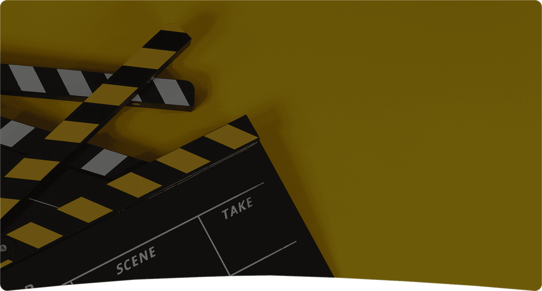 Film clapperboard on yellow background